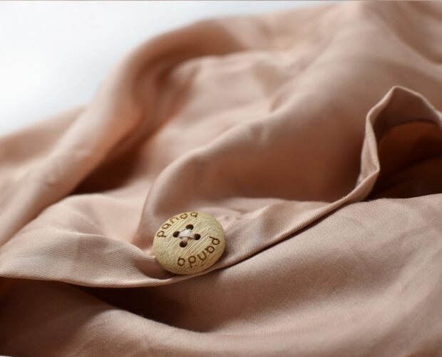 Buttons on Bedding Pink Close Up