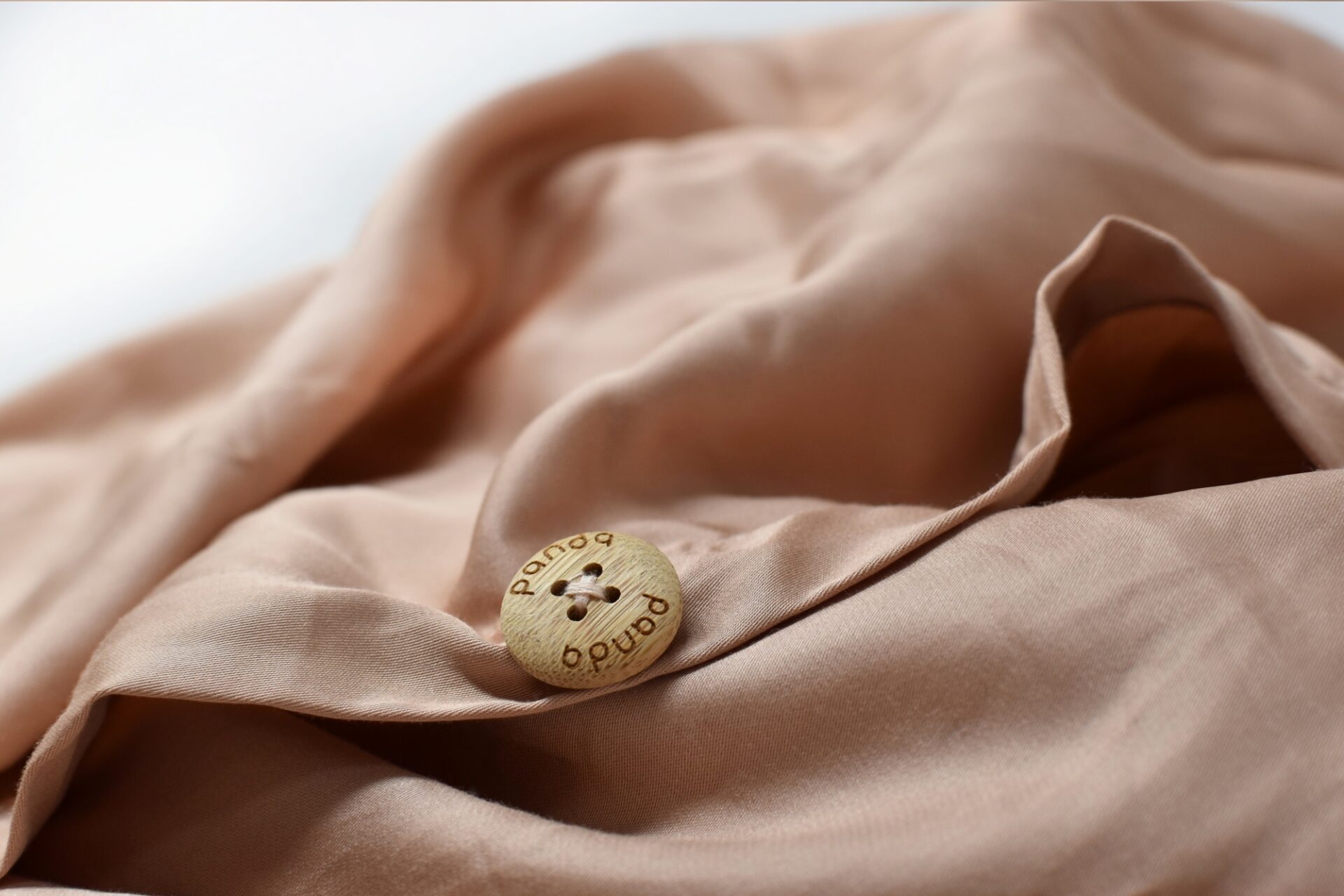 Buttons on Bedding Pink Close Up