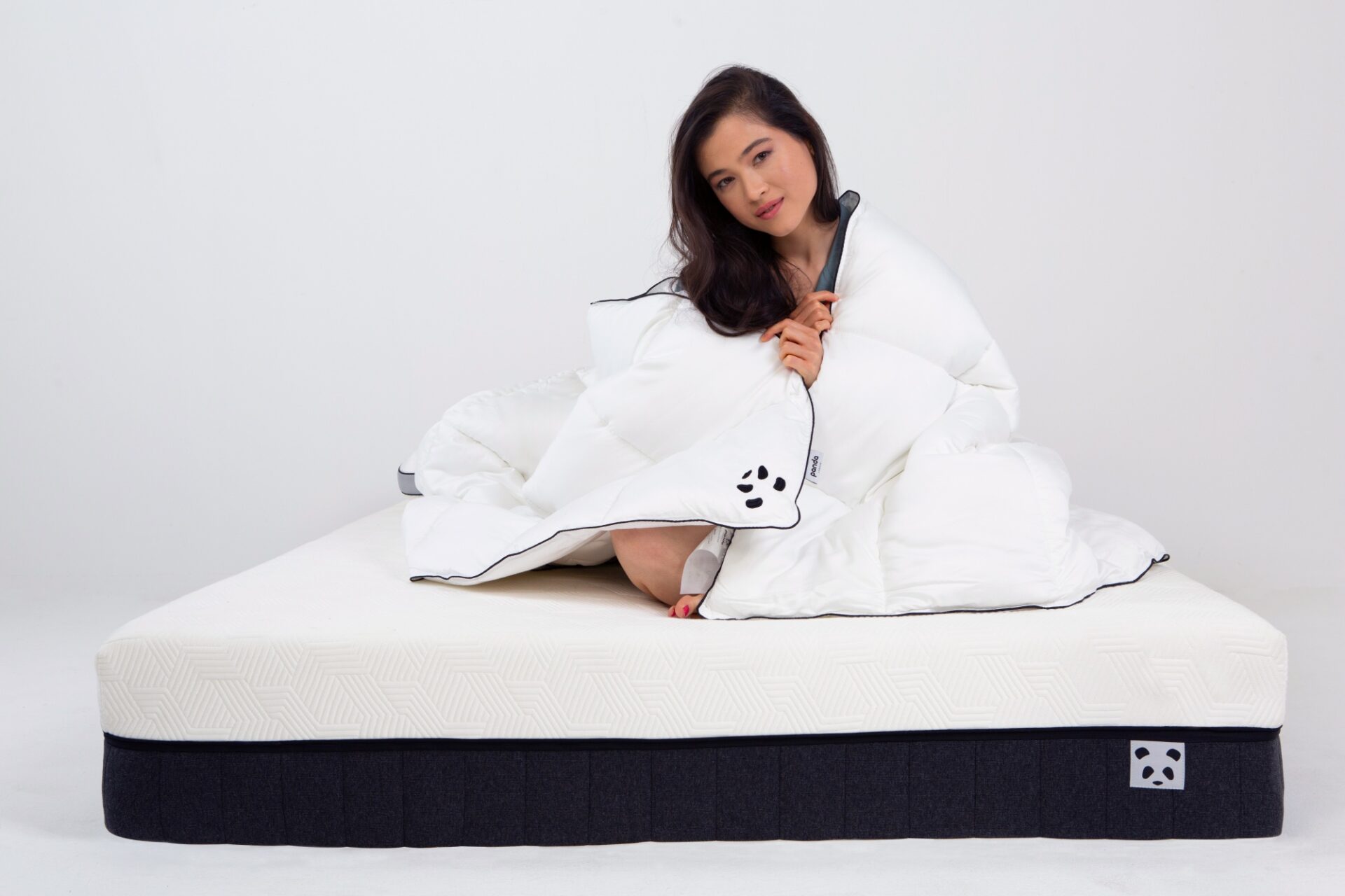 Cloud Bamboo Duvet girl cuddled on the Hybrid Bamboo Mattress