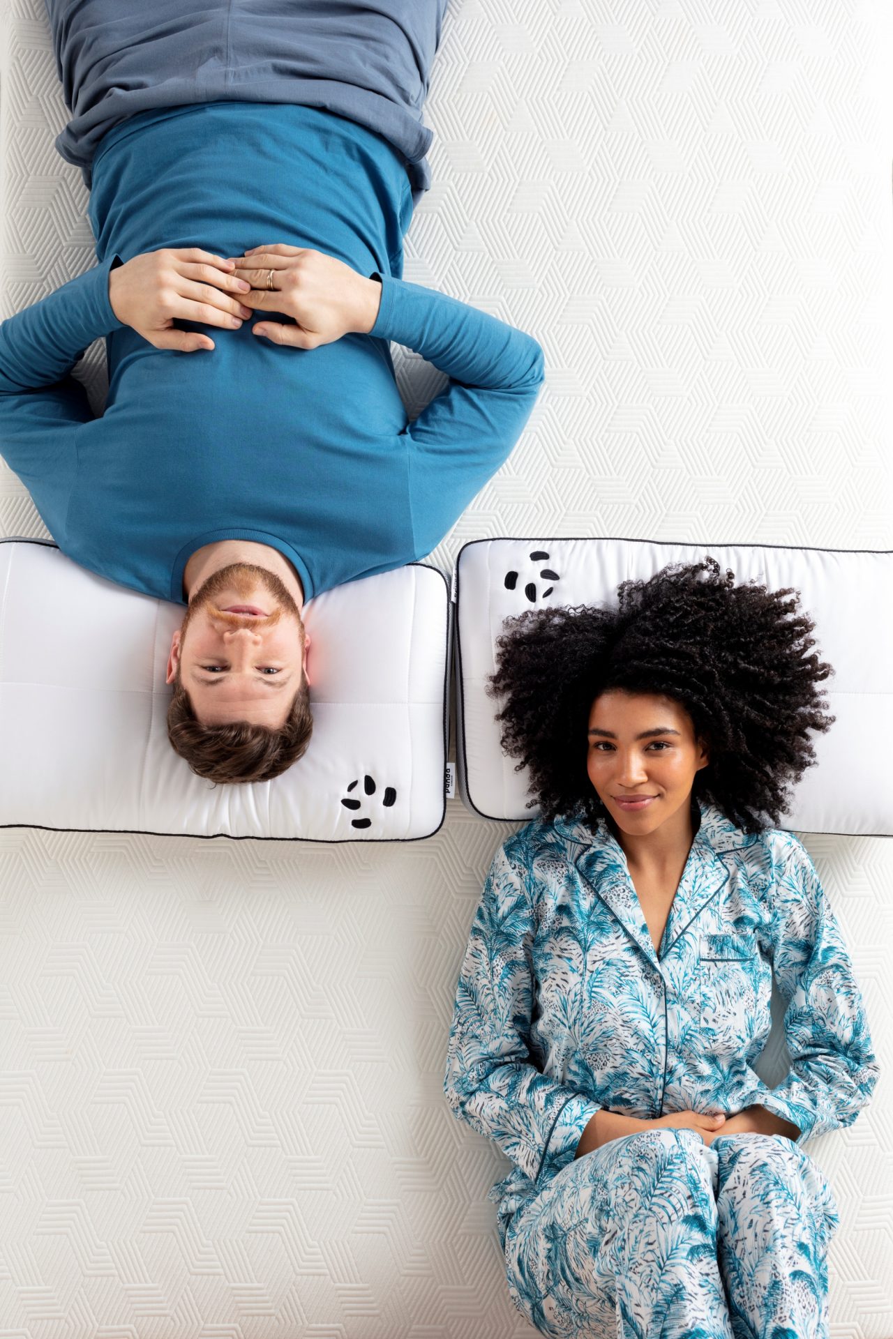 couple laying on a hybrid bamboo pillow