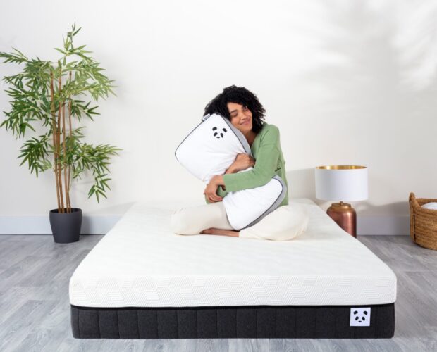 Girl hugging Hybrid Bamboo Pillow on a Hybrid Bamboo Mattress