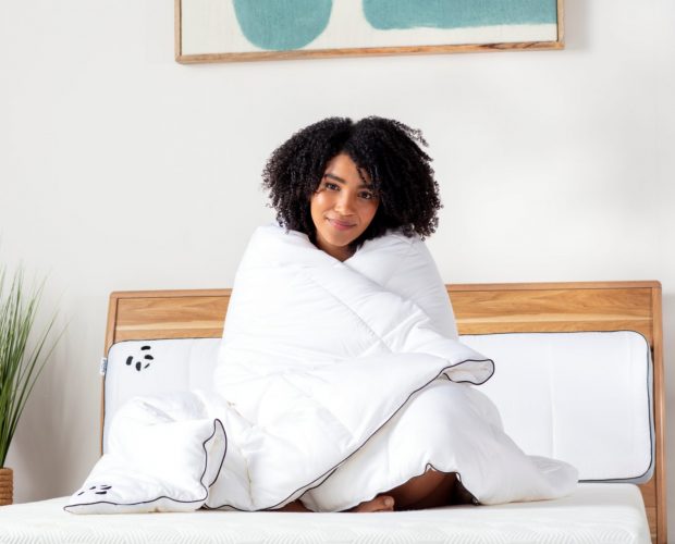 girl with a bamboo cloud duvet sitting on a hybrid bamboo mattress