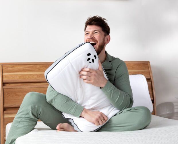 guy holding Hybrid Bamboo Pillow