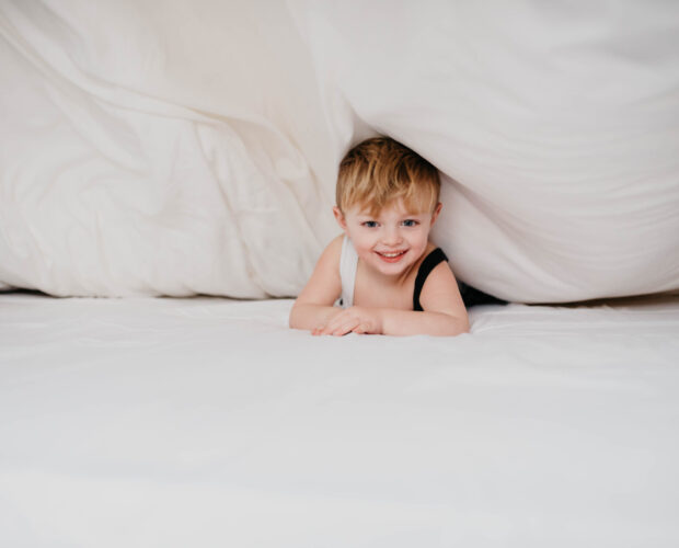 Kid under Duvet