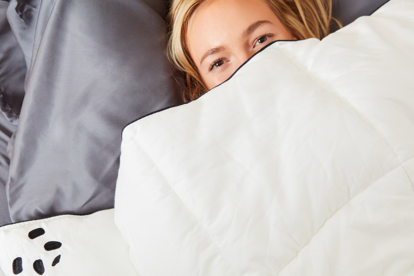 Woman Laying in Bed Using Cloud Bamboo Duvet