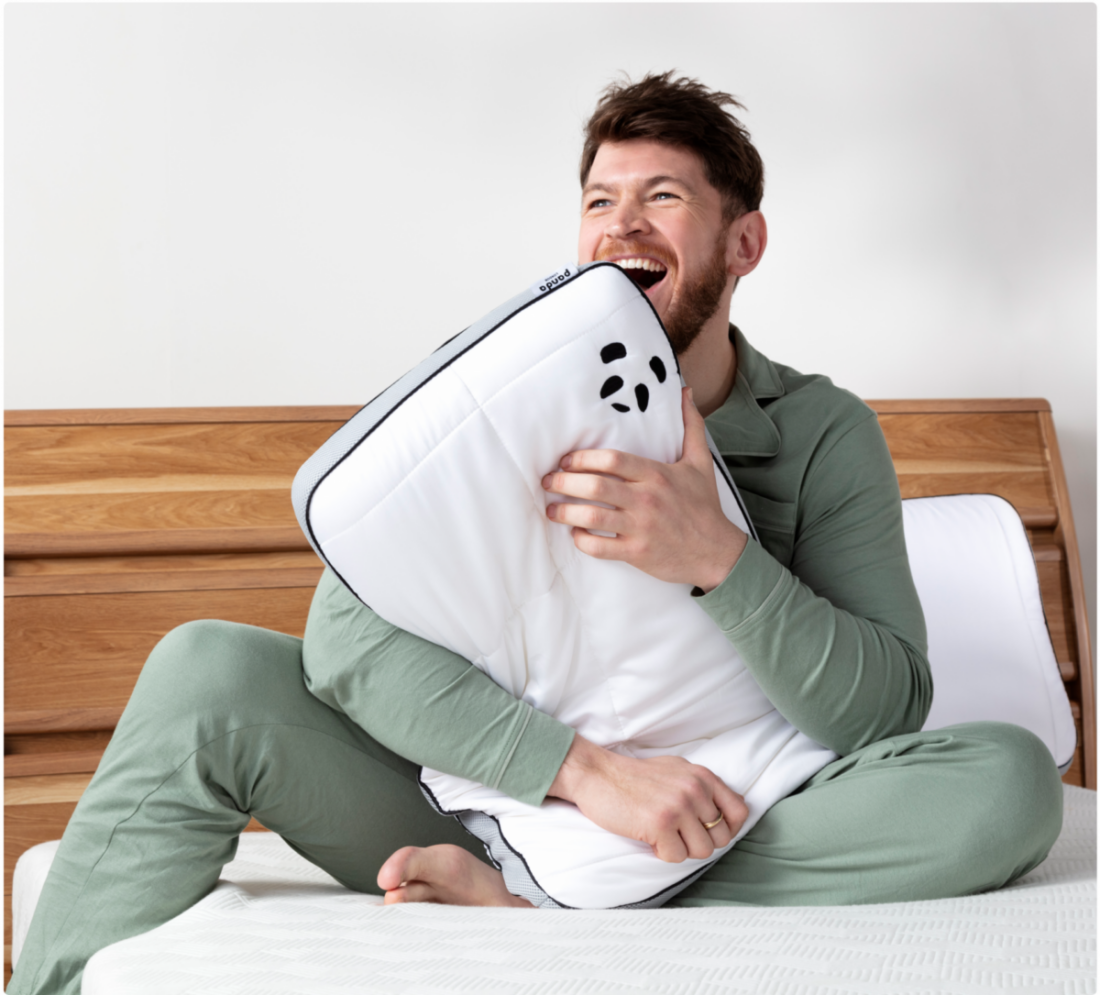 Guy hugging Hybrid Bamboo Pillow Xmas